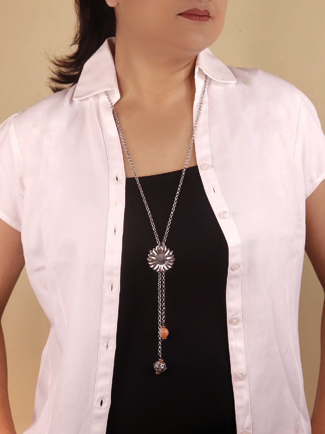 The pendant has an intricate design with a long temple jewellery patte –  Look Ethnic